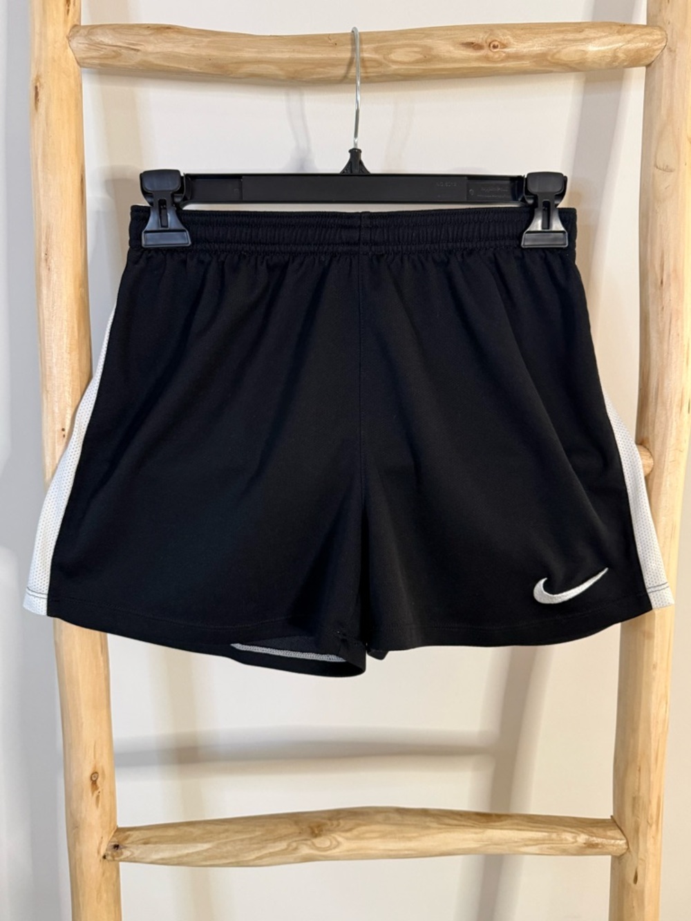 Nike Black Athletic Shorts with White Swoosh and Side Panels